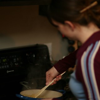 Penelope Stirring a Steaming Pot on the Stove