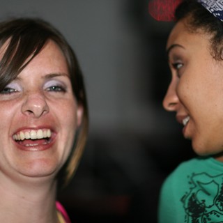 Two Women Share a Joyful Laughing Moment Together