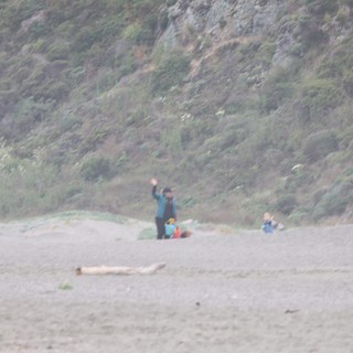 Waving Hello on a Misty Beach Camping Day