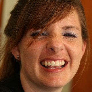 Joyful Woman Laughing with Eyes Closed
