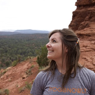 Woman Gazing Upward at Sedona Red Rock Formation