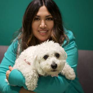 Woman and her white bichon-poodle mix