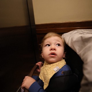 Toddler's Wonder-Filled Gaze from Bedroom Floor