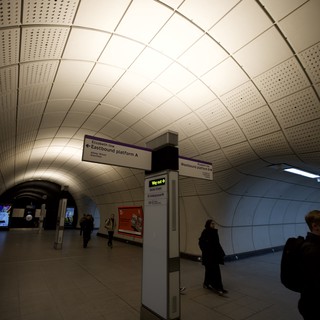 Underground Station Platform Directional Signage at Rush Hour