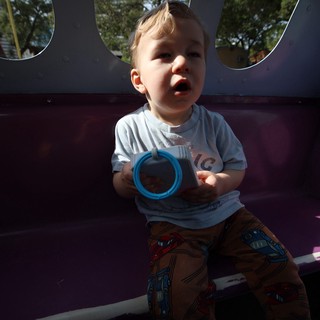 Toddler Playing with Blue Ring in Bounce House