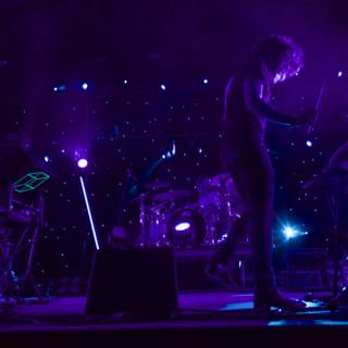Rocking the Stage under Purple Lights
