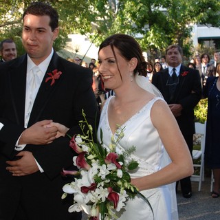 Bride and Groom Exchange Vows at Outdoor Ceremony