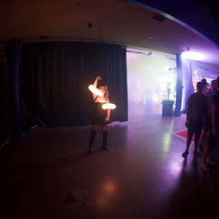 Fire dancer in a dark urban club