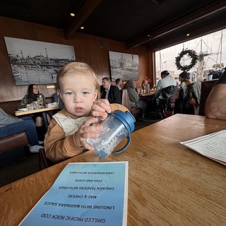 Toddler with Sippy Cup at Waterfront Restaurant