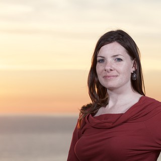 Woman in Red at Golden Hour Seaside