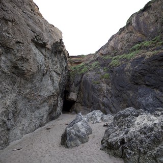 Hidden Sea Cave Nestled Between Dramatic Coastal Cliffs