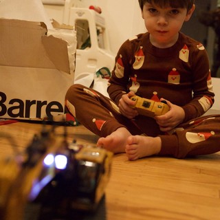 Young Boy Playing with Remote Control Toy on Christmas Morning