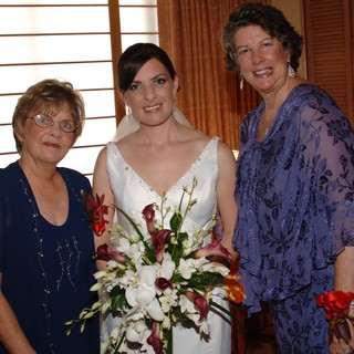 Bride Poses with Family on Wedding Day