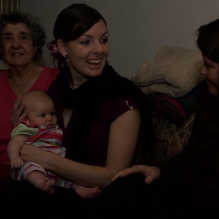 Three Generations of Women Share Tender Moment