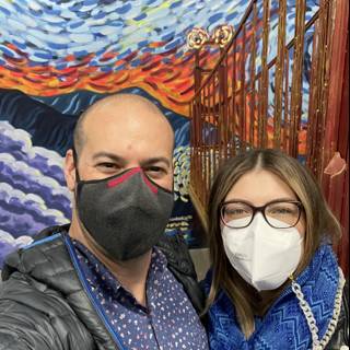 Masked in Front of Mural