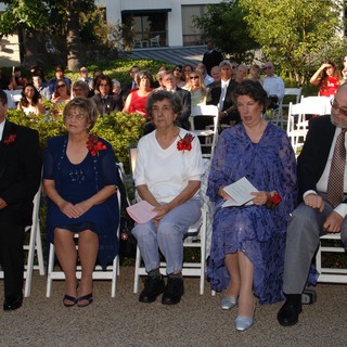 Family Members Seated at Outdoor Wedding Ceremony