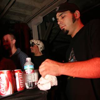 Man in Black Shirt Enjoying Soda with Friends