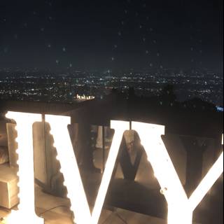 Vivid Viv Sign Lights Up the Night Sky