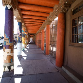 Traditional Adobe Covered Walkway with Painted Columns