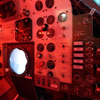 Vintage Aircraft Cockpit Illuminated in Red Light