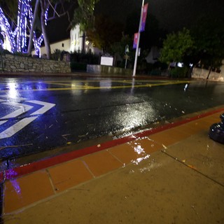 Flooded Street with Directional Markings at Night