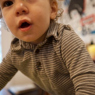 Curious Toddler Looking Up with Wonder