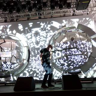 Man on stage with giant screen