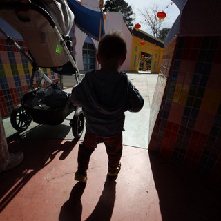 Child Explores Colorful Fantastical Village Square