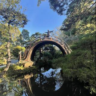 Serene Bridge Reflection in Japanese Garden