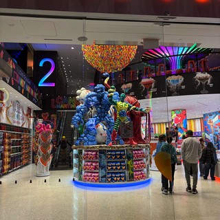 Colorful Candy Store Display with Blue Balloon Sculpture