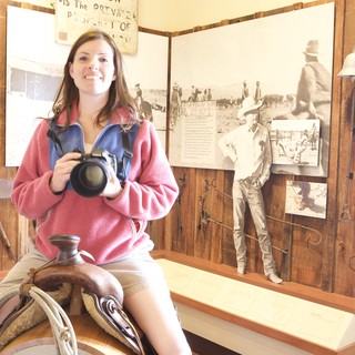 Photographer Poses on Saddle at Western Heritage Museum