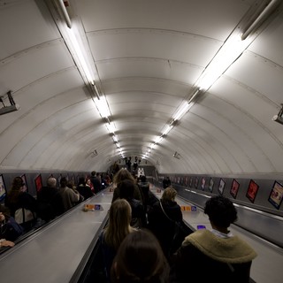 Commuters on London Underground Escalator During Morning Rush