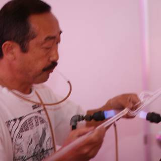 Mustachioed man with a microphone