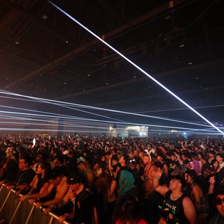 Massive Crowd Surges Under Laser Light Show