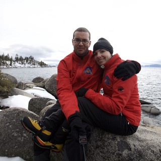 Couple Embracing by Snowy Lake Tahoe Shore