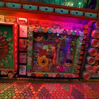 Vibrant Folk Art Installation with Illuminated Decorative Walls