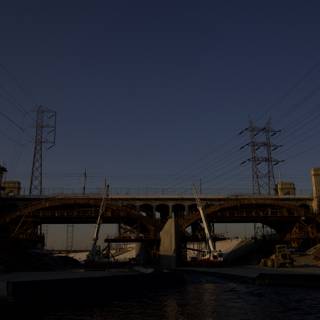Freeway Overpass Bridge with Power Lines and Boat