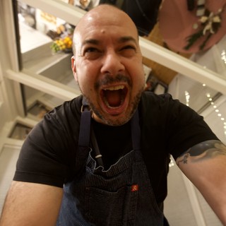 Exuberant Chef Takes Selfie in Modern Kitchen