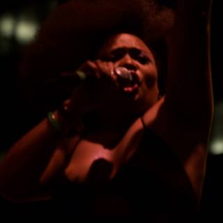 Soulful Solo: Afro Singer with Microphone
