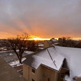 Sunset Glow on Snowy Rooftop