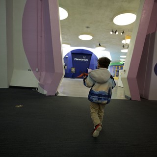 Child Running Through Museum Exploration Entrance