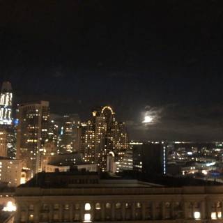 City Skyscrapers Illuminate Under Moonlight