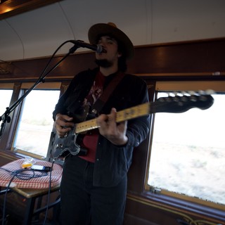 Musician Performing on Boat During Winter Cruise