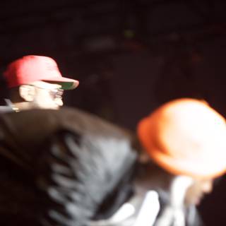 Red-Hatted Men on Stage