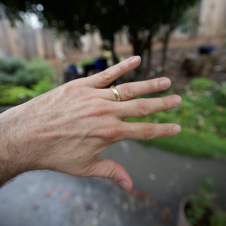 Hand with Wedding Ring in Garden Setting