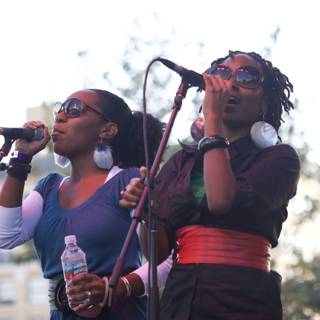 Two Women Singing Their Hearts Out