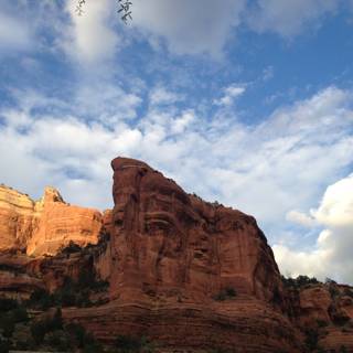 Majestic Red Rock Formation and Cloudy Skies