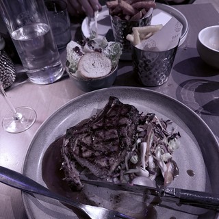 Fine Dining Experience with Grilled Steak and Shared Appetizers