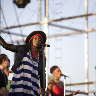 Lauryn Hill Rocks the Crowd with a Striped Dress and Hat
