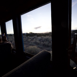 Desert Sunset View Through Train Window at Dusk